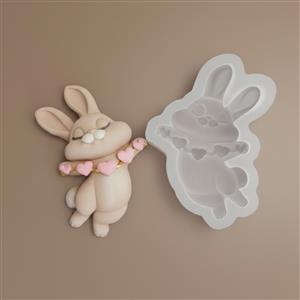 Rabbit with string of hearts